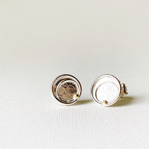 Silver circle earring with 18k gold dot